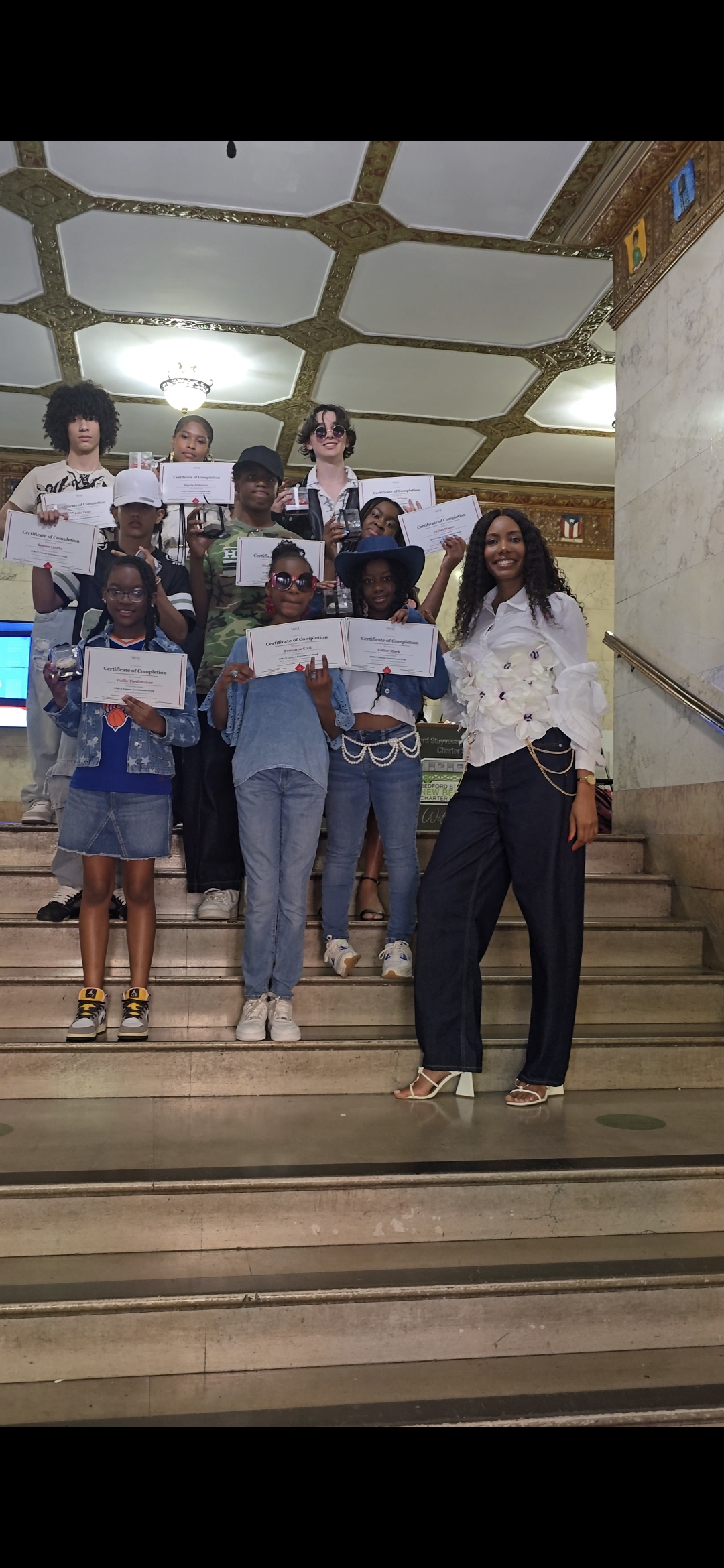 STRUT Esteem students holding certificates of completion at a showcase